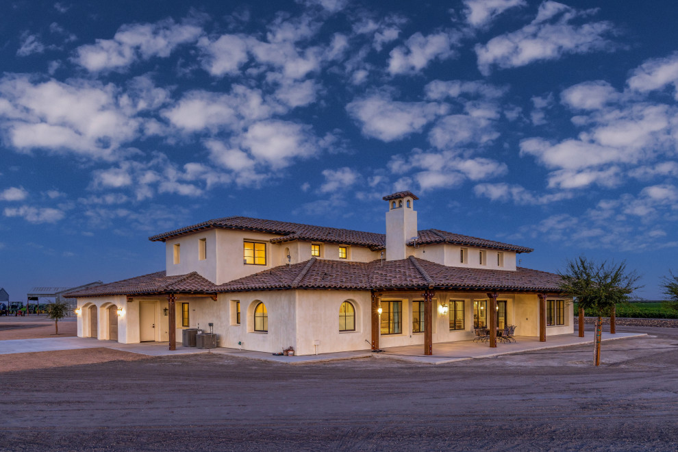 Tuscan Estate Rear Elevation under a Dramatic Dusk Sky | Tuscan Farmhouse