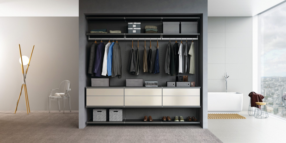 Design ideas for a mid-sized modern men's built-in wardrobe in Nashville with flat-panel cabinets, white cabinets and carpet.