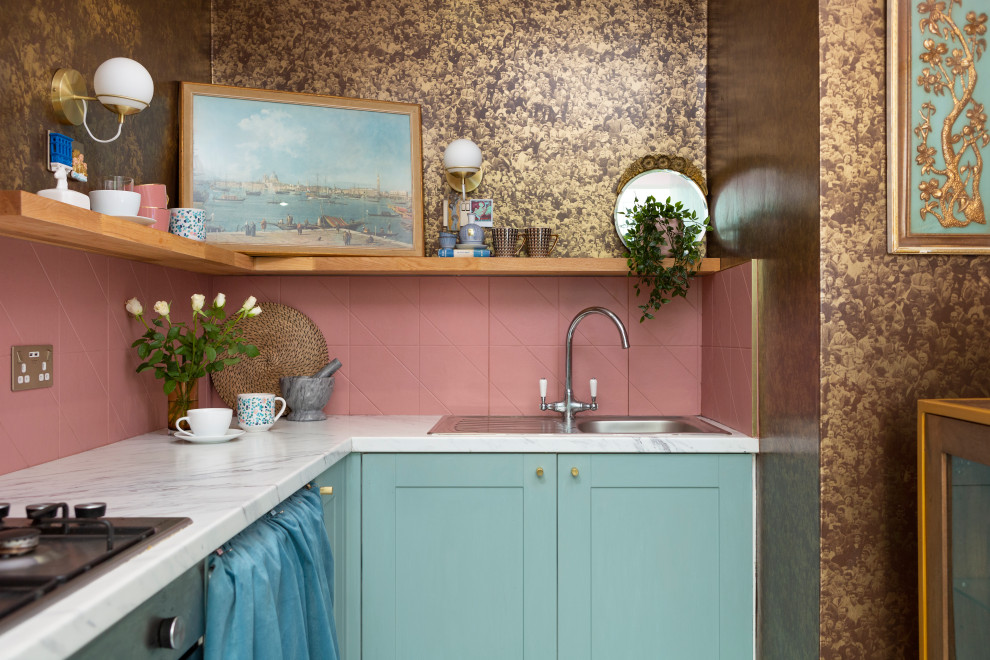 Design ideas for a small eclectic l-shaped separate kitchen in Edinburgh with a single-bowl sink, shaker cabinets, blue cabinets, laminate benchtops, pink splashback, ceramic splashback, stainless steel appliances, vinyl floors, no island, multi-coloured floor and grey benchtop.