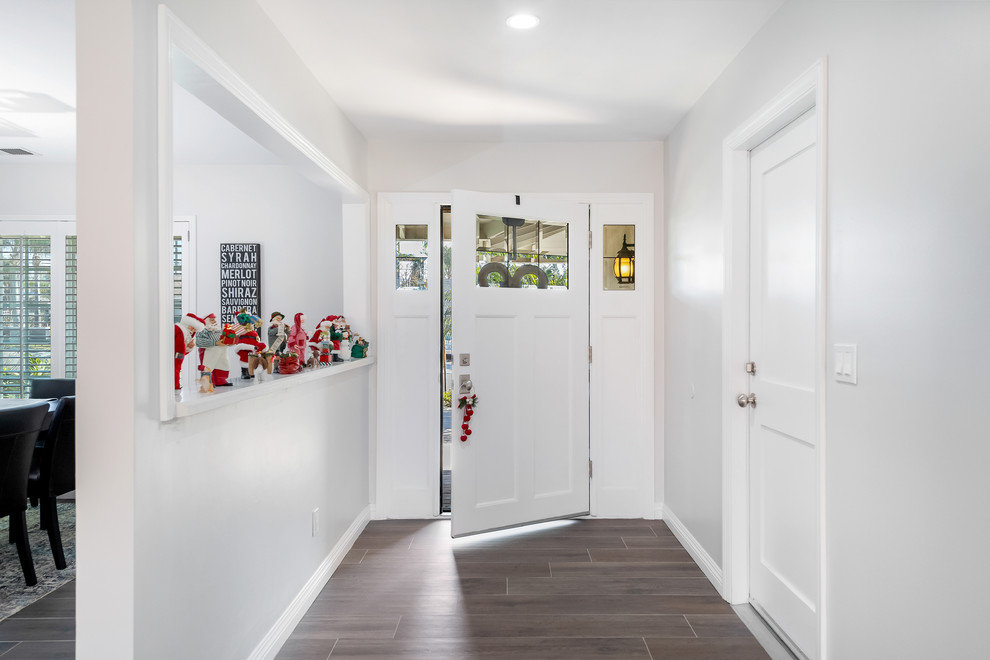 Mid-sized transitional home design photo in Orange County