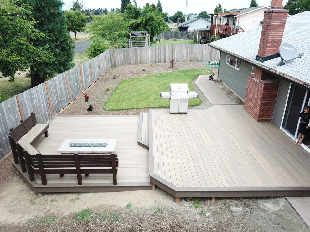 Design ideas for a mid-sized contemporary backyard patio in Portland with a fire feature, decking and no cover.