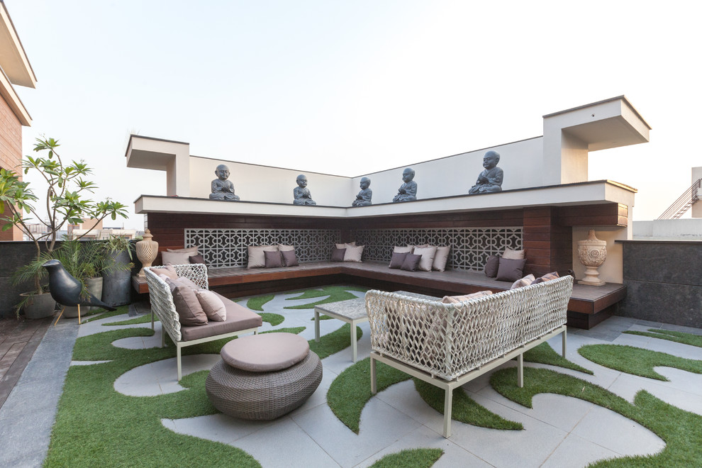 Photo of a large contemporary rooftop and rooftop deck in Delhi with no cover.