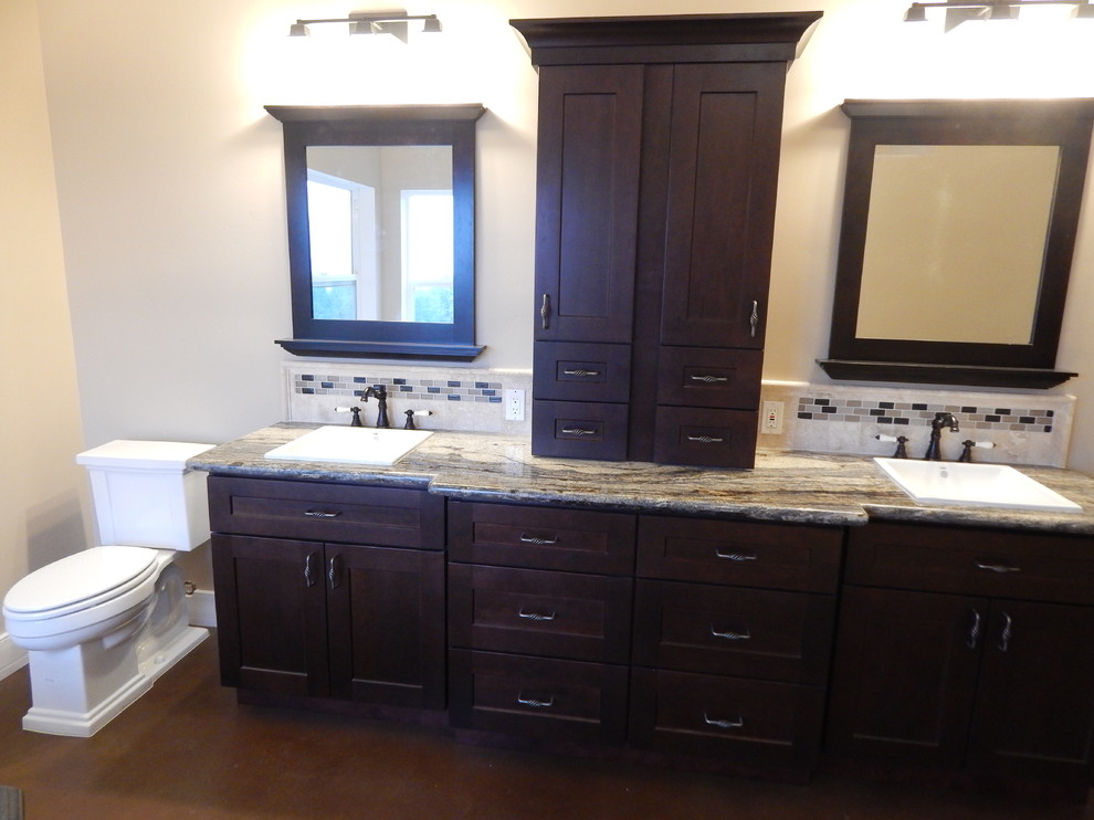 Design ideas for a mid-sized arts and crafts 3/4 bathroom in Sacramento with recessed-panel cabinets, dark wood cabinets, a two-piece toilet, beige tile, ceramic tile, beige walls, concrete floors, a drop-in sink, engineered quartz benchtops, beige floor and beige benchtops.