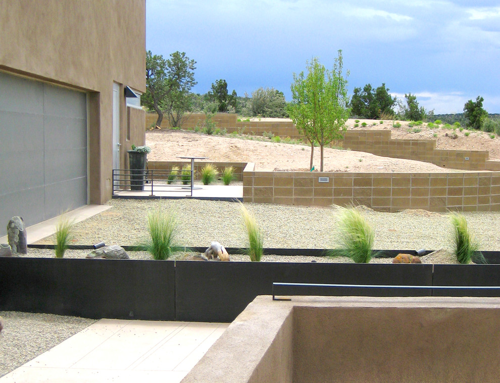This is an example of a mid-sized contemporary one-storey stucco beige exterior in Albuquerque.