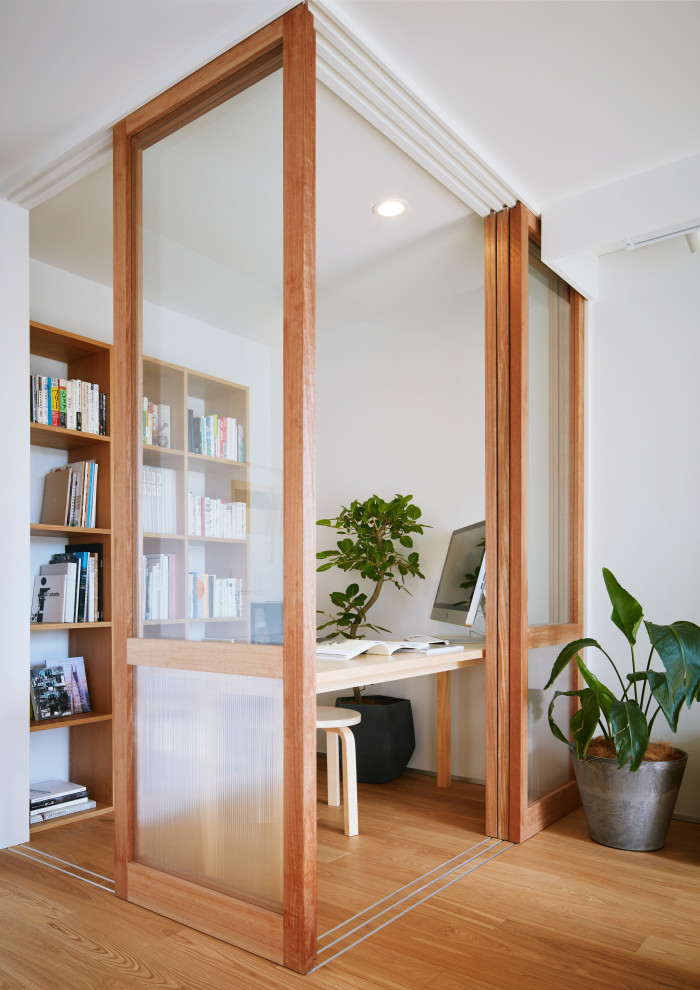 Photo of a medium sized study in Other with white walls, no fireplace, a freestanding desk, a timber clad ceiling, tongue and groove walls, plywood flooring and beige floors.