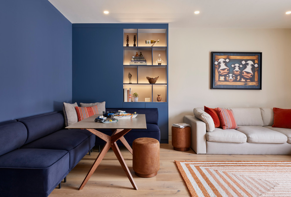 Inspiration for a medium sized scandi living room in Surrey with light hardwood flooring.