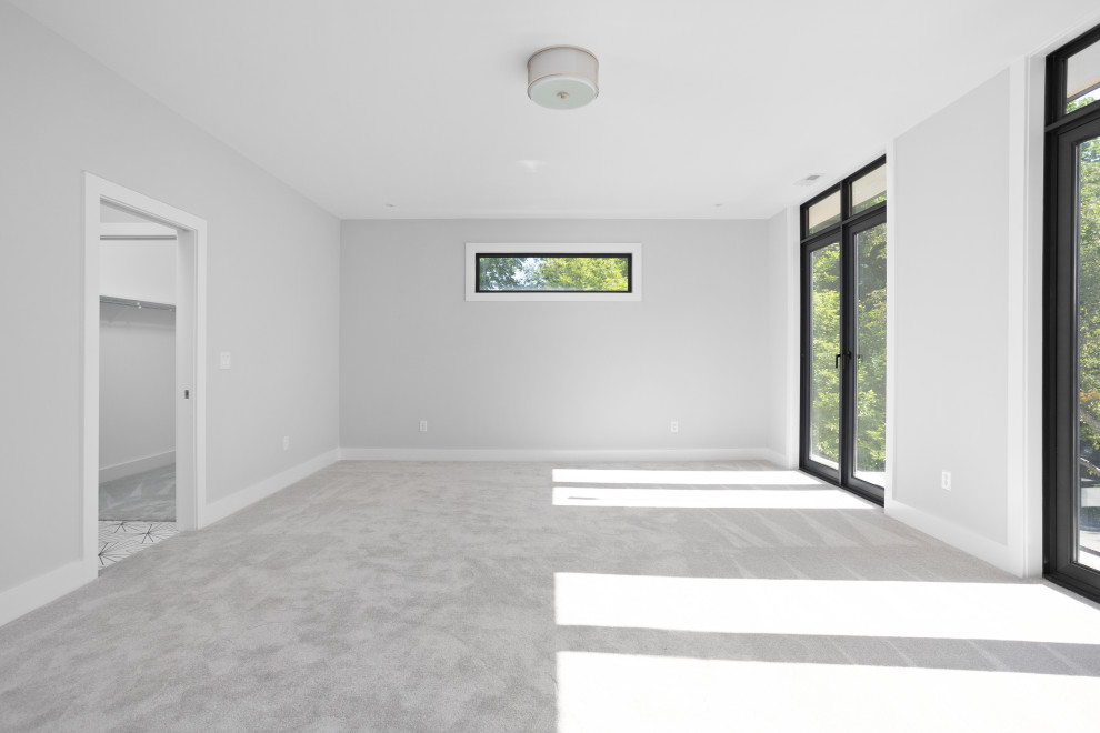 Diseño de habitación de invitados minimalista grande con paredes grises, moqueta y suelo gris
