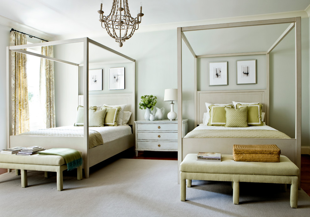 Large guest bedroom in Atlanta with green walls and dark hardwood floors.