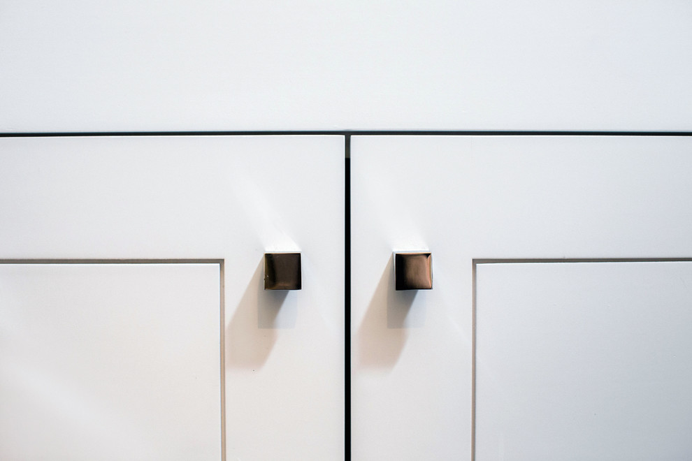 Inspiration for a small transitional 3/4 ceramic tile and gray floor home design remodel in Austin with flat-panel cabinets, white cabinets, a one-piece toilet, blue walls, an undermount sink, granite countertops and gray countertops