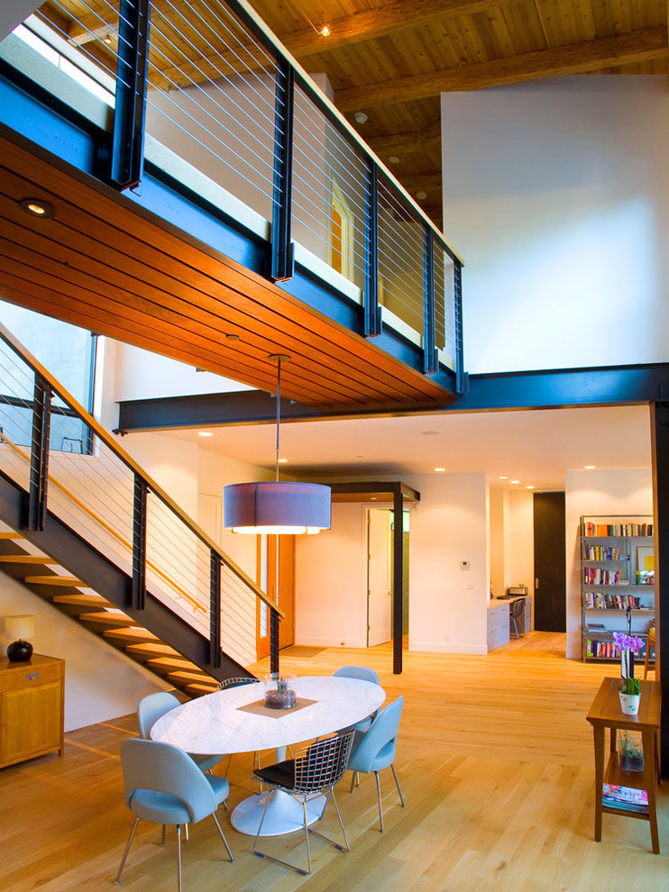 Photo of an industrial wood straight staircase in San Francisco with open risers.