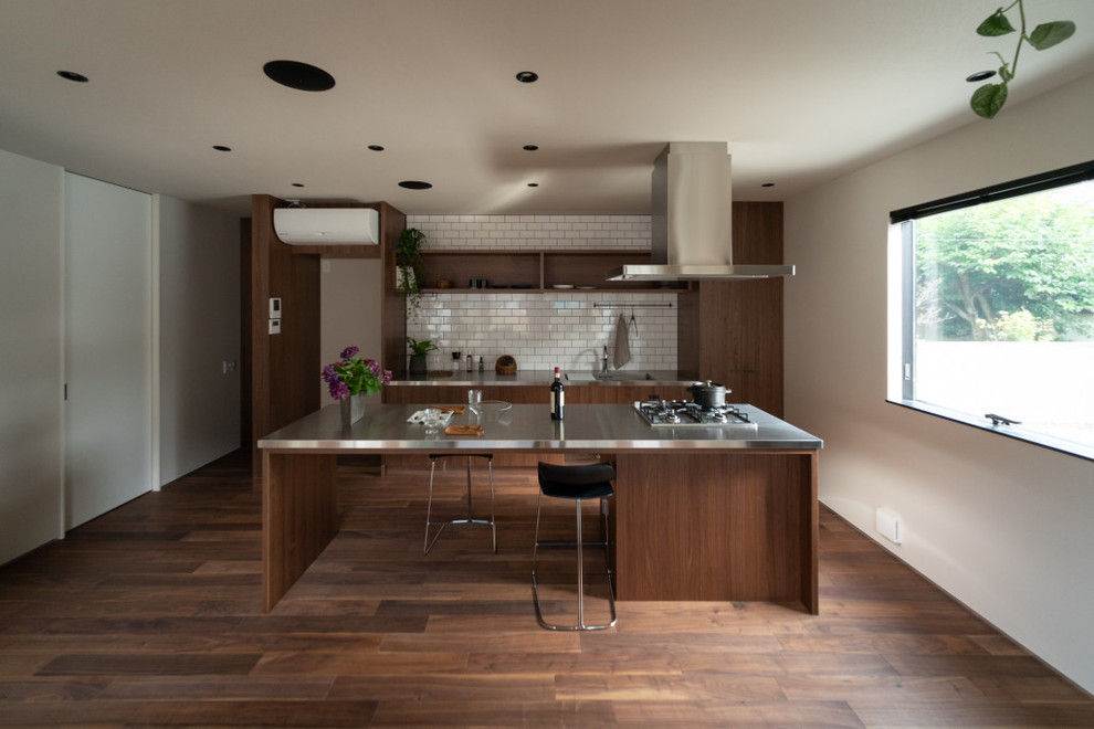 Design ideas for an asian galley eat-in kitchen in Other with an integrated sink, open cabinets, dark wood cabinets, stainless steel benchtops, stainless steel appliances, dark hardwood floors and with island.