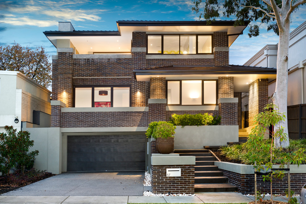 Photo of a contemporary two-storey brick exterior in Melbourne.