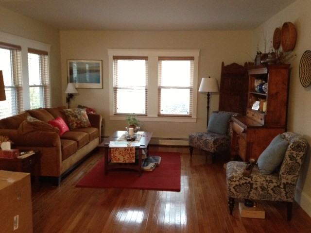 How do I add rugs to a long narrow room?