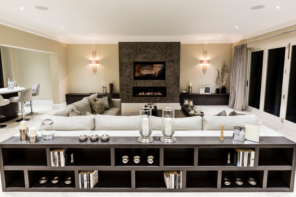Inspiration for a contemporary open concept living room in Surrey with beige walls, a ribbon fireplace and a wall-mounted tv.
