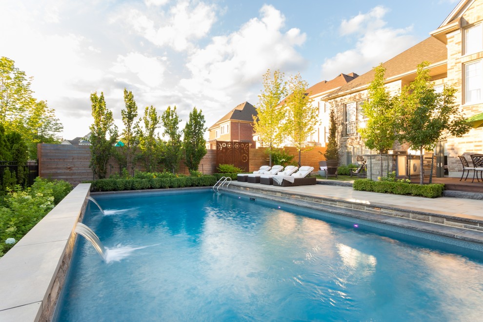 Inspiration for a transitional backyard pool remodel in Toronto