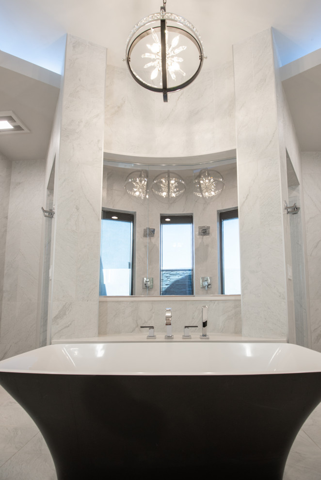 Design ideas for an expansive modern ensuite bathroom in Phoenix with a freestanding bath and a walk-in shower.