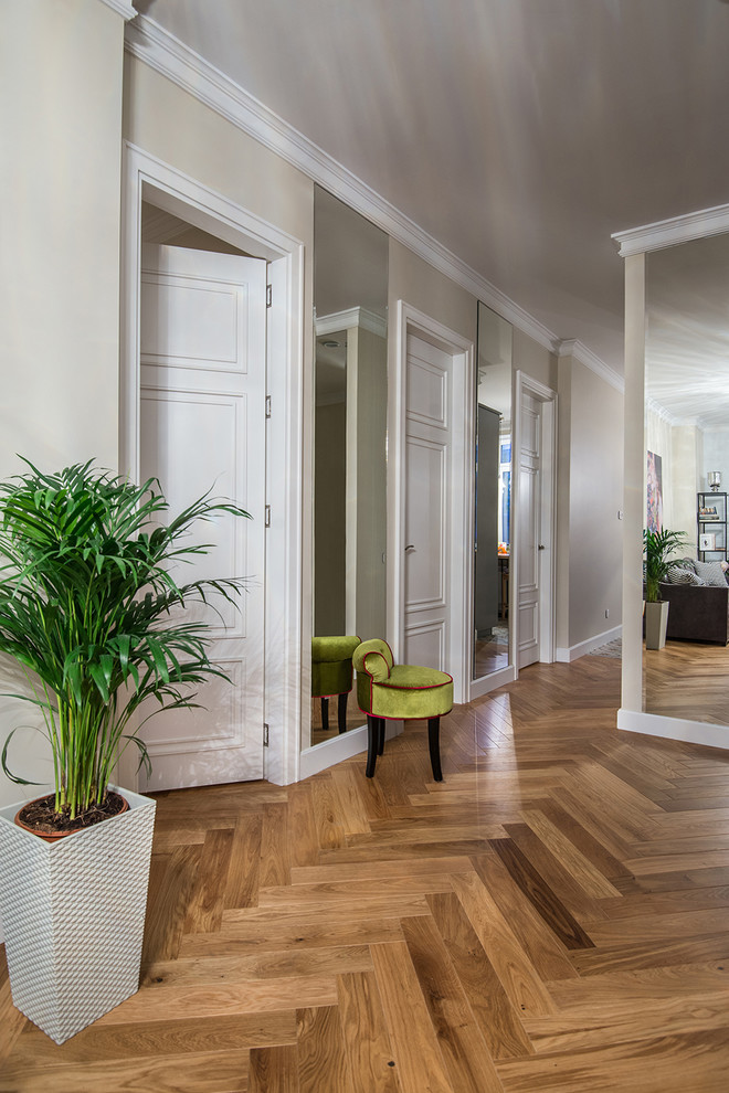 Photo of a contemporary entryway in Moscow with medium hardwood floors.