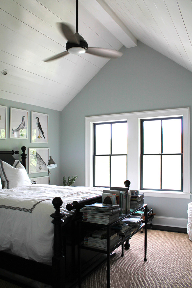 Inspiration for a mid-sized traditional loft-style bedroom in New York with dark hardwood floors.