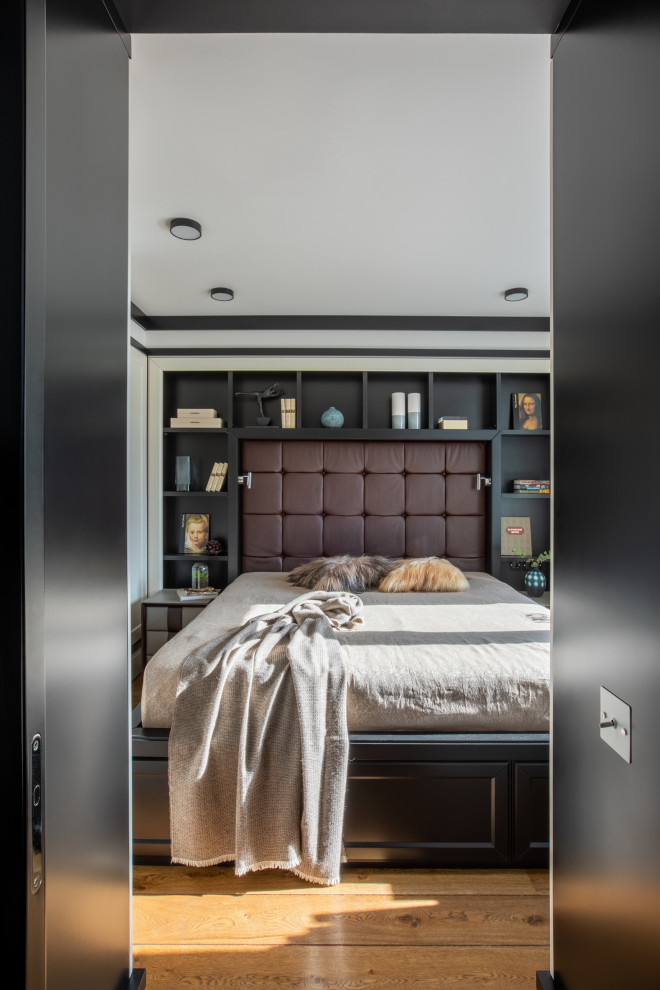 Inspiration for a small transitional master bedroom in Moscow with white walls, medium hardwood floors, no fireplace, brown floor and decorative wall panelling.