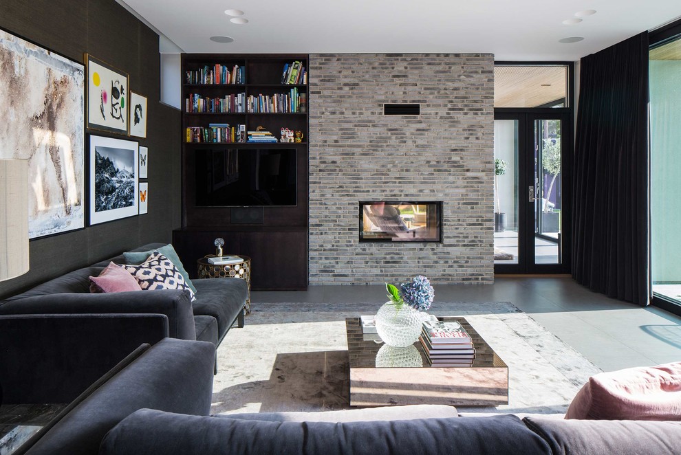 Inspiration for a mid-sized contemporary formal open concept living room in Malmo with black walls, ceramic floors, a two-sided fireplace, a brick fireplace surround and no tv.