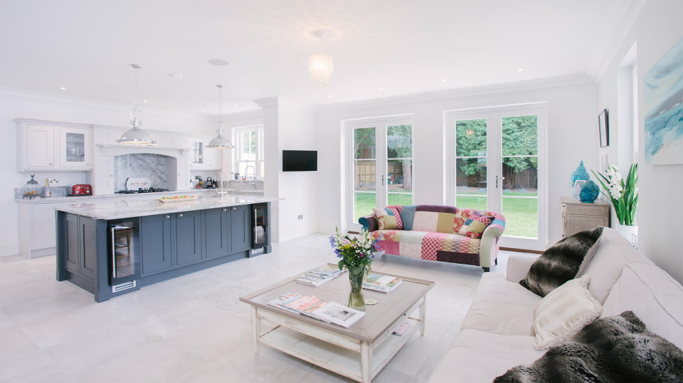 Design ideas for a large grey and black u-shaped open plan kitchen in Sussex with a single-bowl sink, shaker cabinets, grey cabinets, quartz worktops, grey splashback, stone slab splashback, integrated appliances, porcelain flooring, an island, grey floors, grey worktops and feature lighting.
