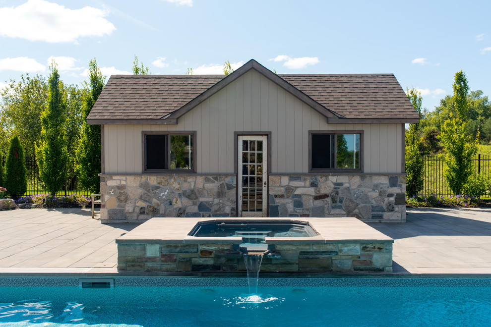 Inspiration for a large contemporary backyard concrete paver and rectangular lap pool fountain remodel