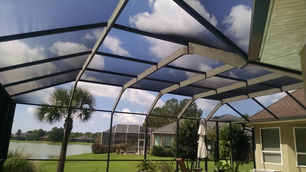 Inspiration for a large transitional backyard stone and custom-shaped hot tub remodel in Miami
