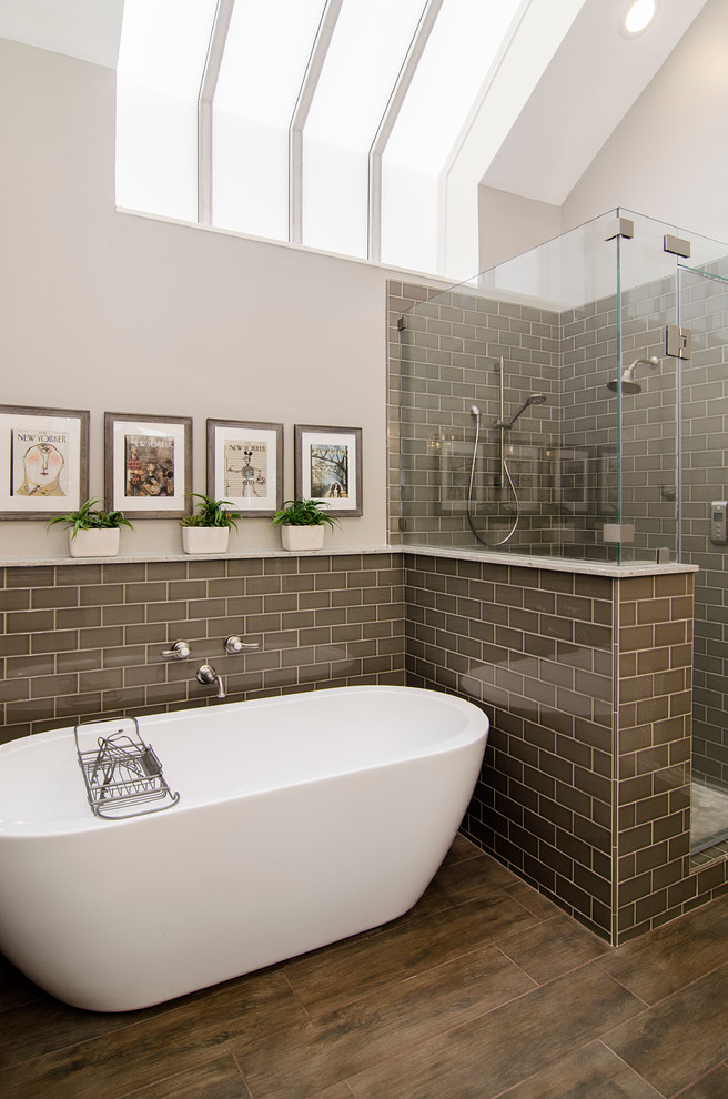 Inspiration for a mid-sized traditional master bathroom in Dallas with an undermount sink, a freestanding tub, an open shower, a one-piece toilet, brown tile, ceramic tile, beige walls and ceramic floors.
