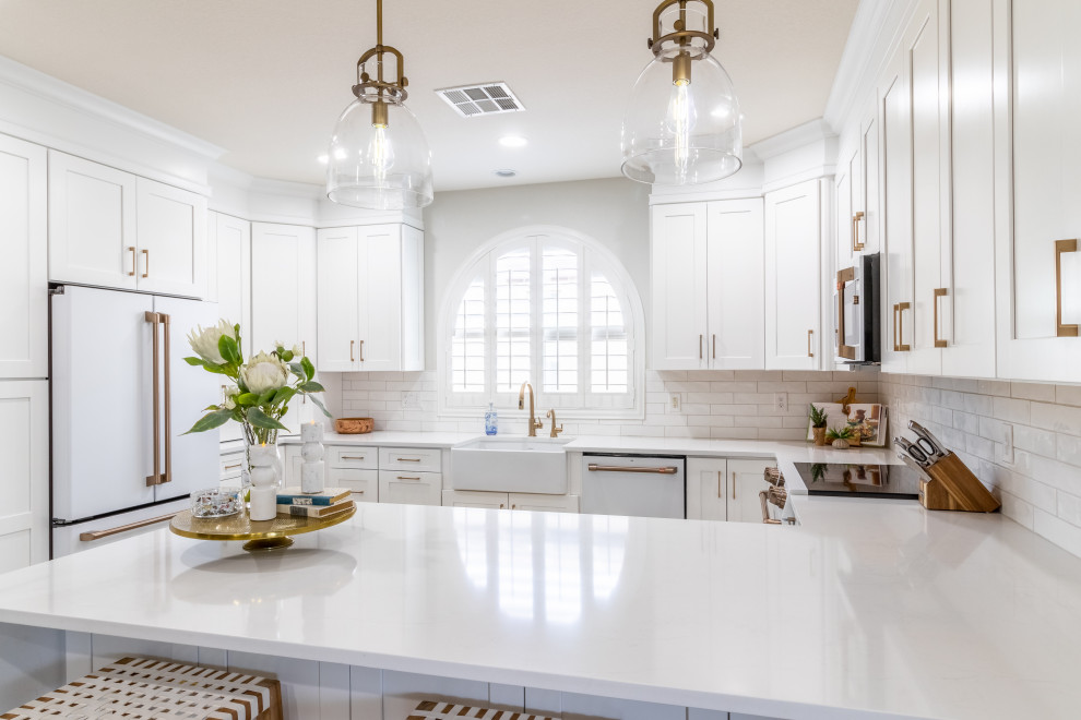 Transitional kitchen photo in Phoenix with shaker cabinets, white cabinets, quartz countertops, white backsplash, white appliances and white countertops
