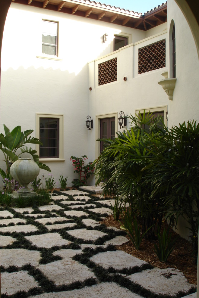 Design ideas for a mediterranean courtyard patio in Miami.
