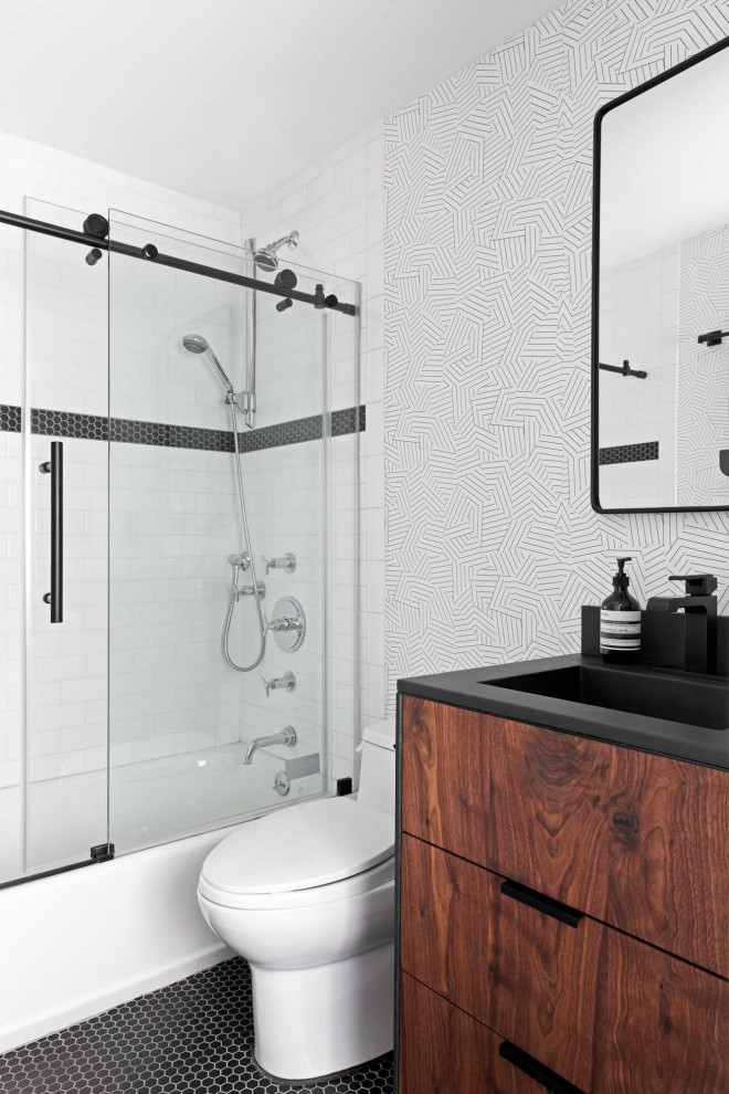 Small trendy 3/4 white tile and subway tile ceramic tile, black floor, single-sink and wallpaper bathroom photo in New York with flat-panel cabinets, medium tone wood cabinets, a one-piece toilet, white walls, an integrated sink, concrete countertops, black countertops and a freestanding vanity