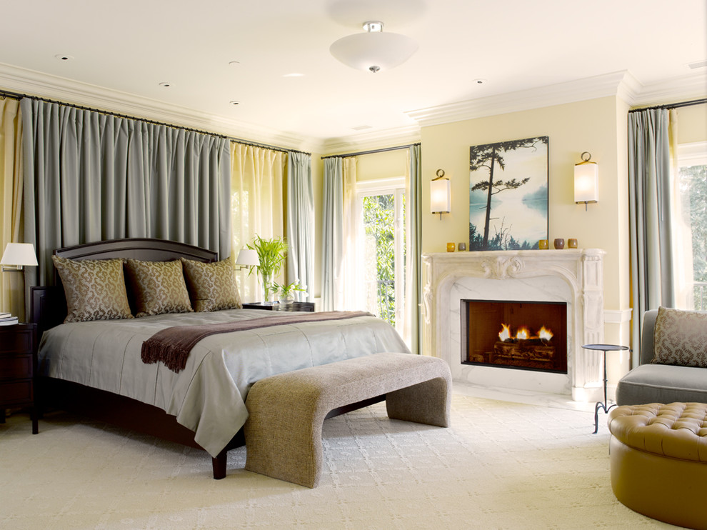 This is an example of a traditional bedroom in Seattle with beige walls and carpet.