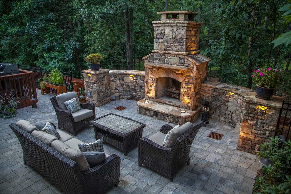 Patio - mid-sized traditional backyard brick patio idea in Atlanta with a fire pit and no cover