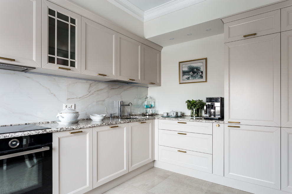 Inspiration for a mid-sized transitional l-shaped eat-in kitchen in Saint Petersburg with an undermount sink, beaded inset cabinets, beige cabinets, granite benchtops, white splashback, porcelain splashback, porcelain floors, no island and beige floor.