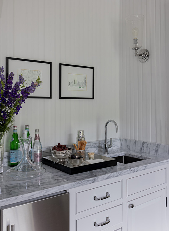 Design ideas for a transitional single-wall wet bar in Boston with an undermount sink, white cabinets, marble benchtops, white splashback and shiplap splashback.