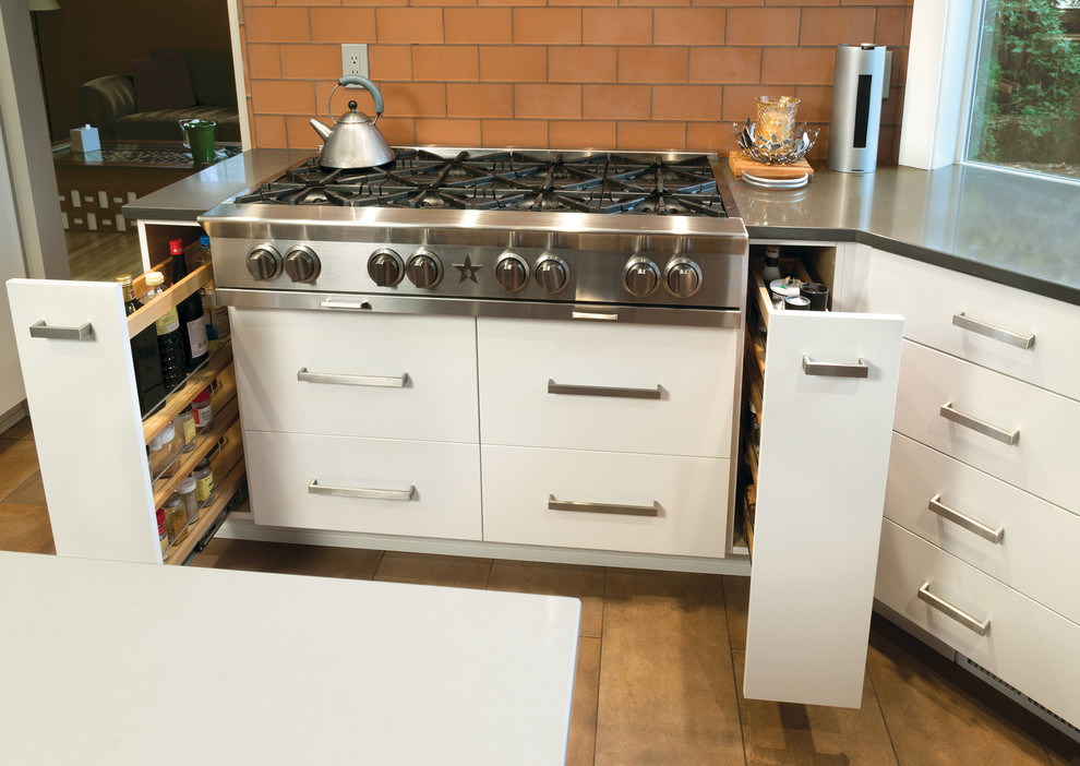 Photo of a contemporary kitchen in Seattle with flat-panel cabinets, white cabinets and with island.