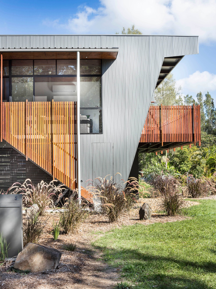 Mid-sized contemporary two-storey grey exterior in Brisbane with mixed siding and a flat roof.