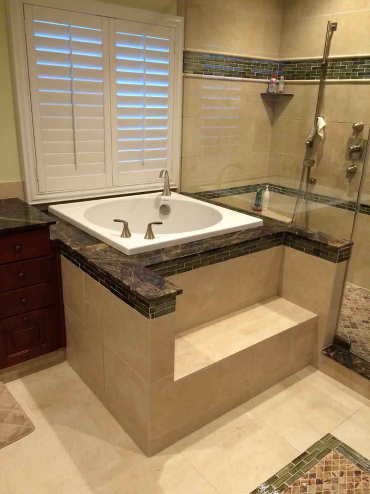 Inspiration for a large transitional master bathroom in Houston with marble benchtops, a japanese tub, an alcove shower, beige tile, porcelain tile, green walls and porcelain floors.