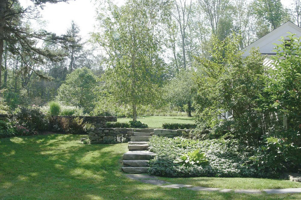 Inspiration for an expansive traditional backyard partial sun formal garden for spring in New York with a garden path and natural stone pavers.