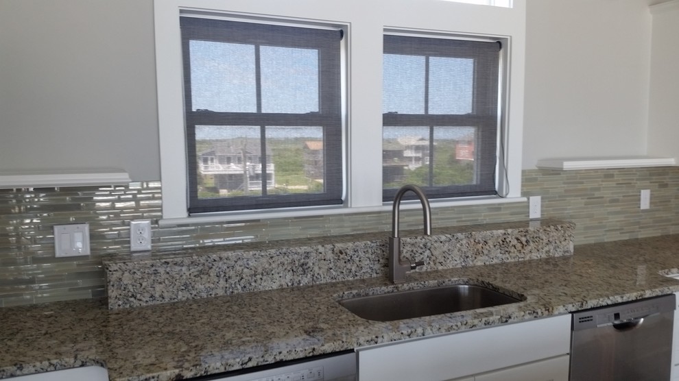 Inspiration for a transitional kitchen remodel with an undermount sink, open cabinets, white cabinets, marble countertops, beige backsplash, glass tile backsplash, stainless steel appliances and an island