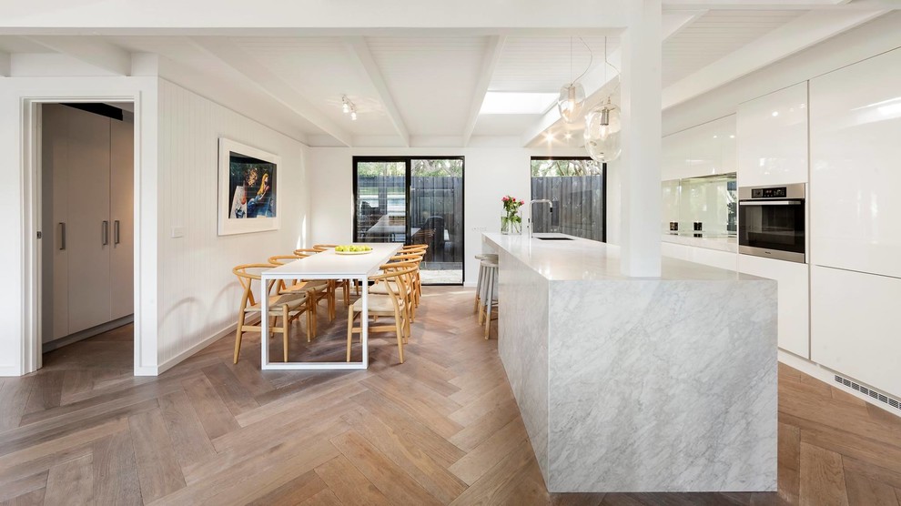 Design ideas for a large contemporary open plan dining in Melbourne with no fireplace and brown floor.