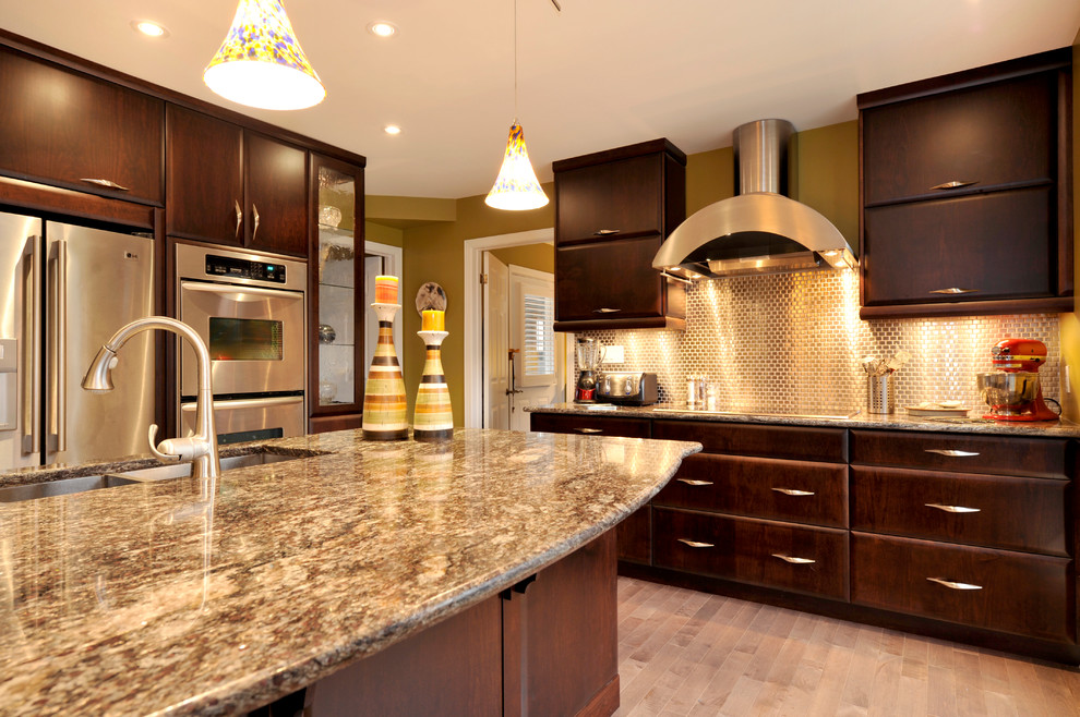 Inspiration for a transitional dark wood floor kitchen remodel in Toronto with a double-bowl sink, flat-panel cabinets, dark wood cabinets, granite countertops, mirror backsplash, stainless steel appliances and an island