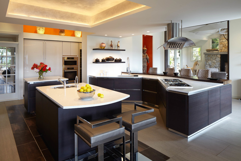 Large transitional ceramic tile and gray floor eat-in kitchen photo in Seattle with quartzite countertops, stainless steel appliances, two islands, white countertops, an undermount sink, flat-panel cabinets and dark wood cabinets