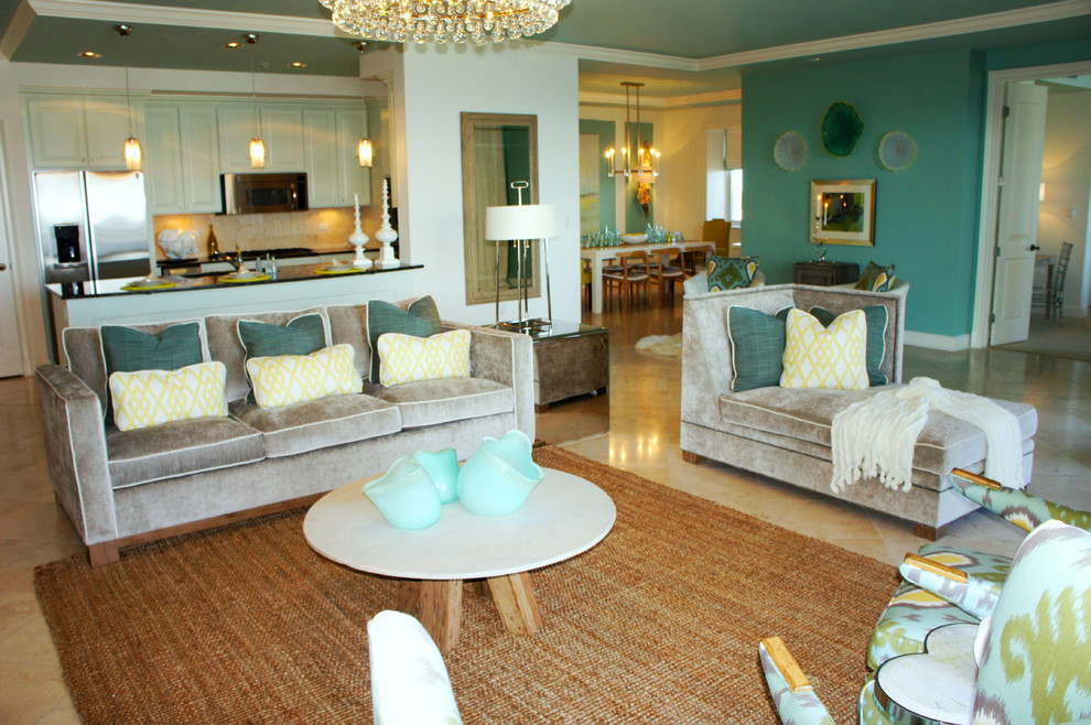 Large contemporary open concept living room in Miami with blue walls, travertine floors, no fireplace and a wall-mounted tv.