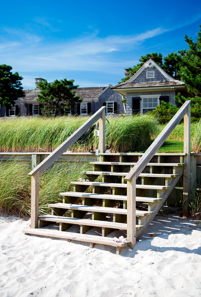 Design ideas for a large beach style backyard full sun garden for summer in Boston.