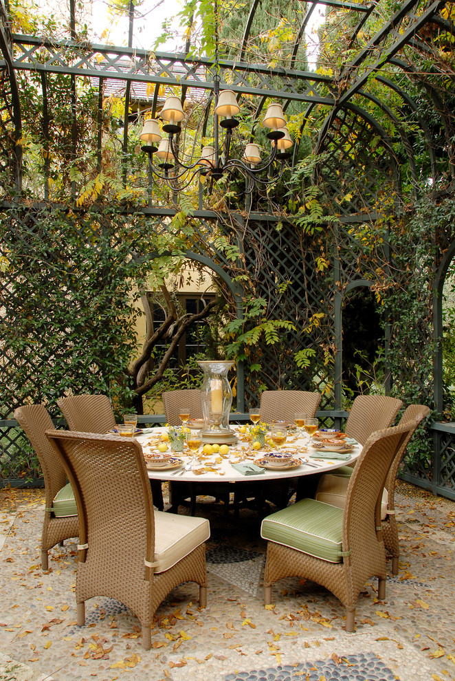 Design ideas for a traditional patio in Los Angeles with a gazebo/cabana and a vertical garden.