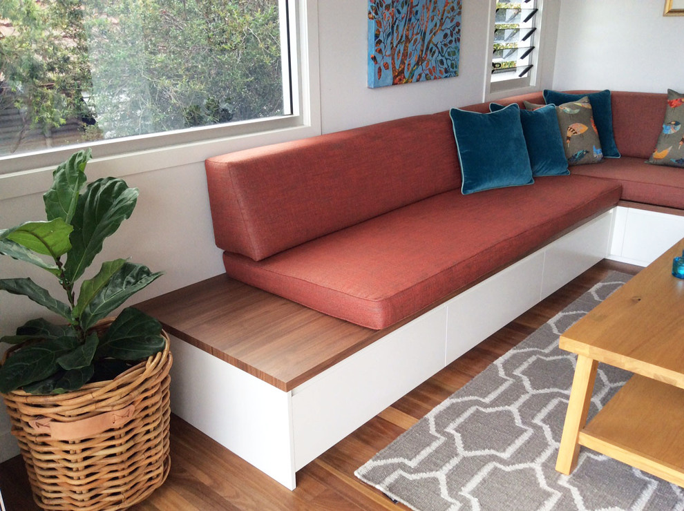 This is an example of a midcentury family room in Brisbane.