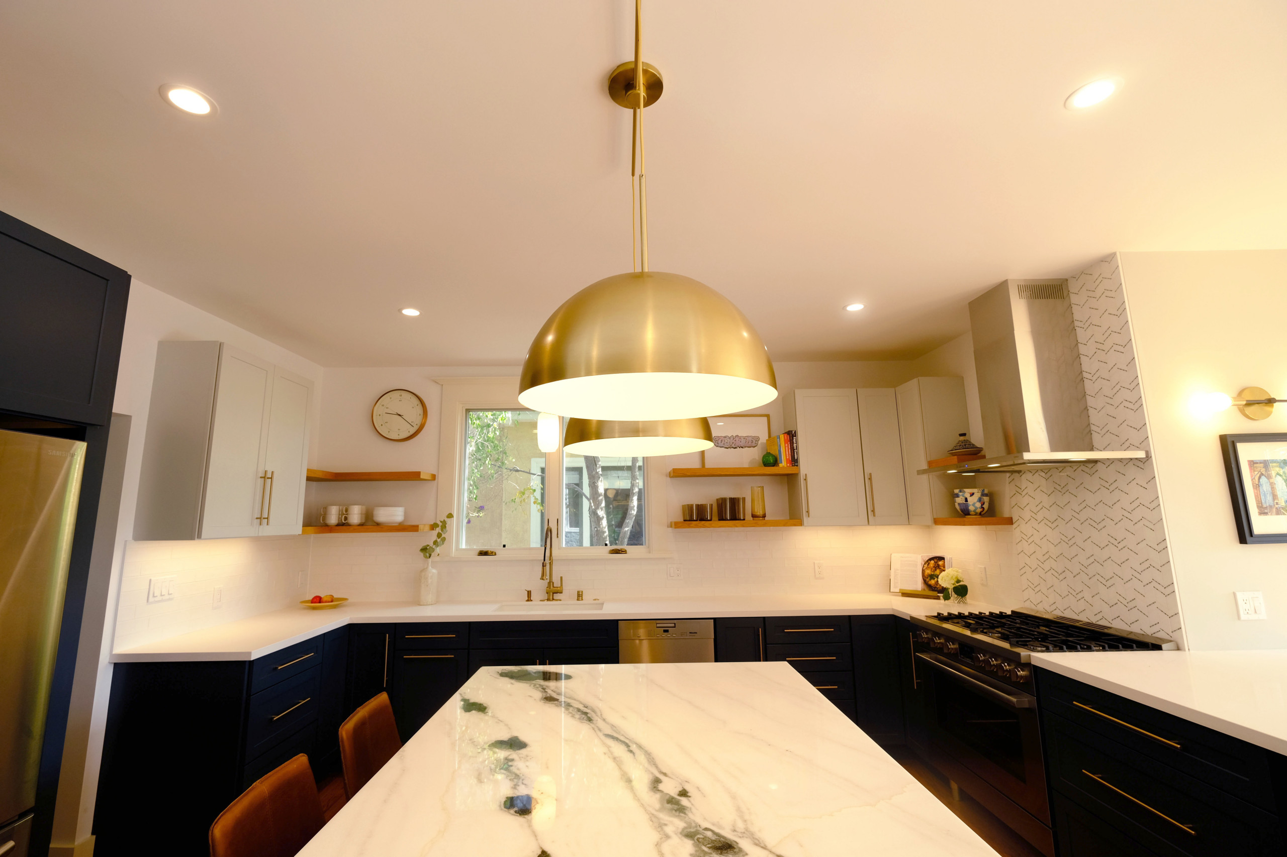 Contemporary Navy Kitchen with Brass Accents