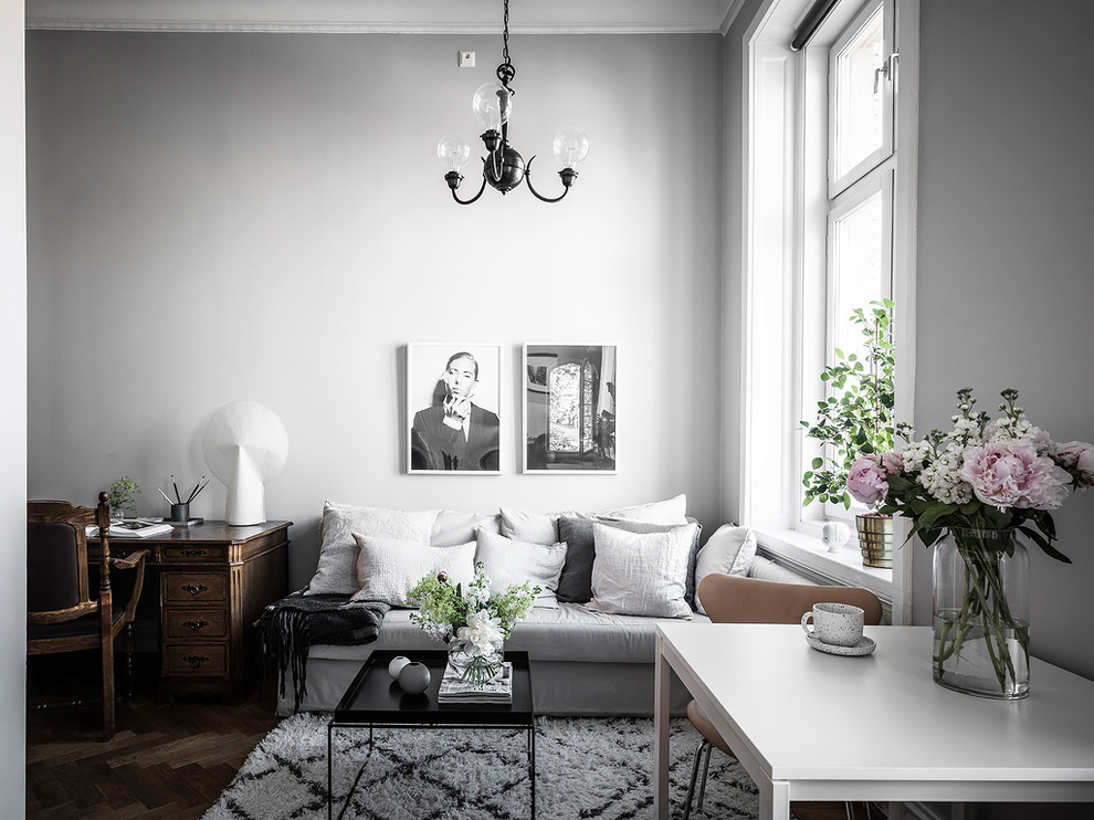 Inspiration for a scandinavian living room in Gothenburg with grey walls, dark hardwood floors and brown floor.
