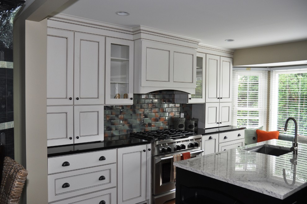 Photo of a large contemporary u-shaped eat-in kitchen in DC Metro with an undermount sink, granite benchtops and with island.